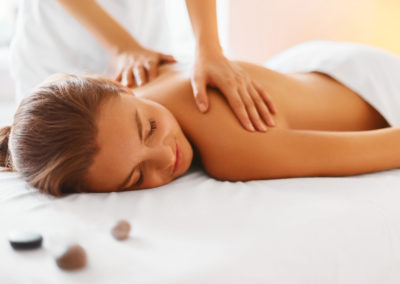 Spa Woman. Female Enjoying Massage in Spa Centre.